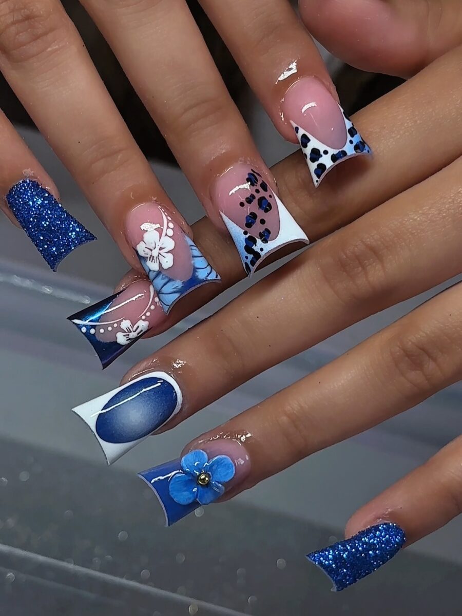 Stunning blue duck nails with floral accents