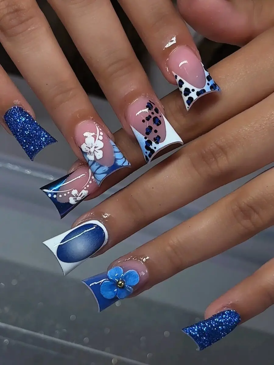 Stunning blue duck nails with floral accents