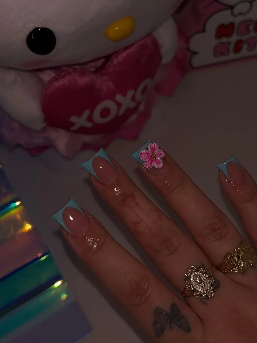 Vibrant Duck Nails with Floral Accent