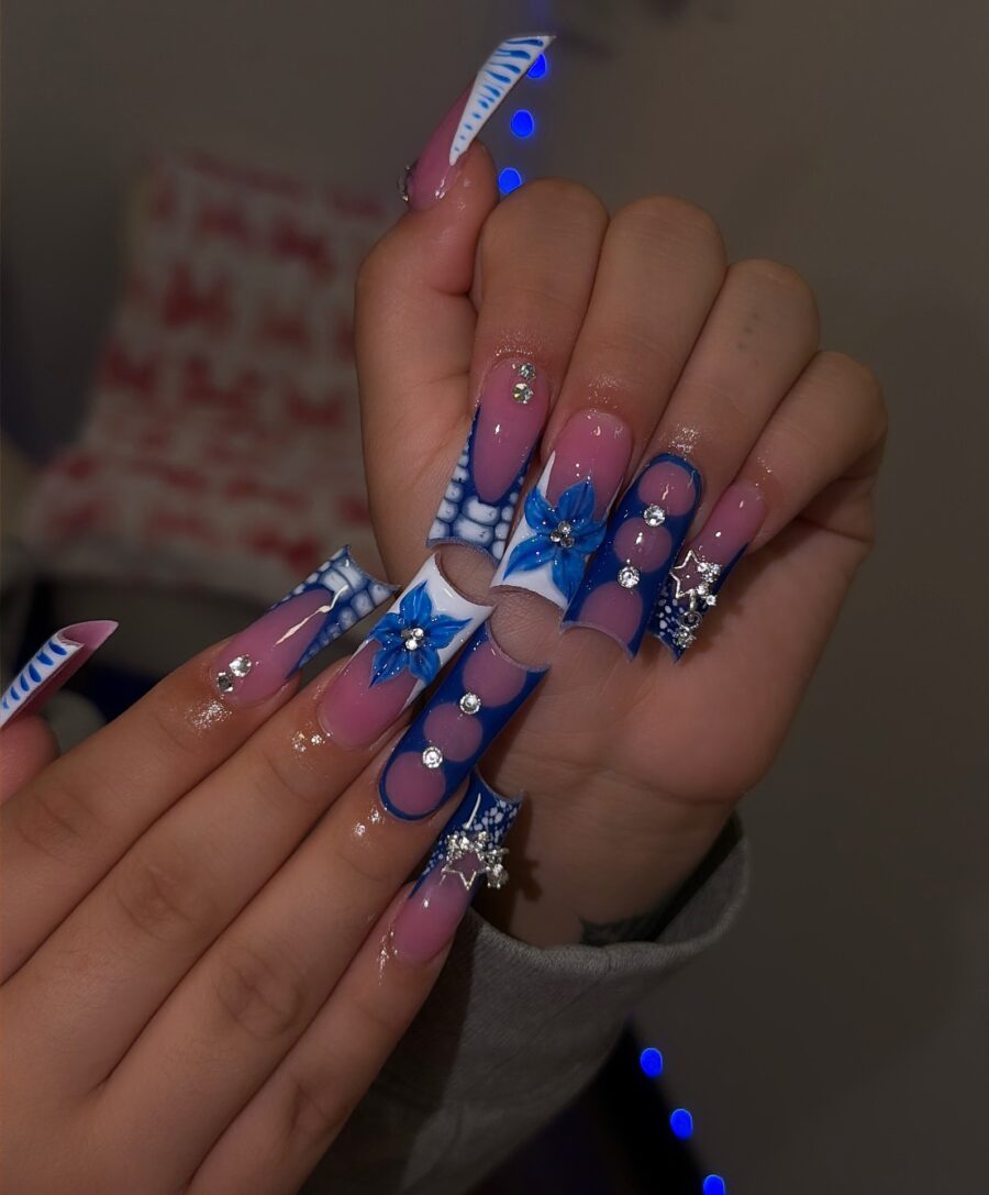 Chic duck nails with blue floral accents