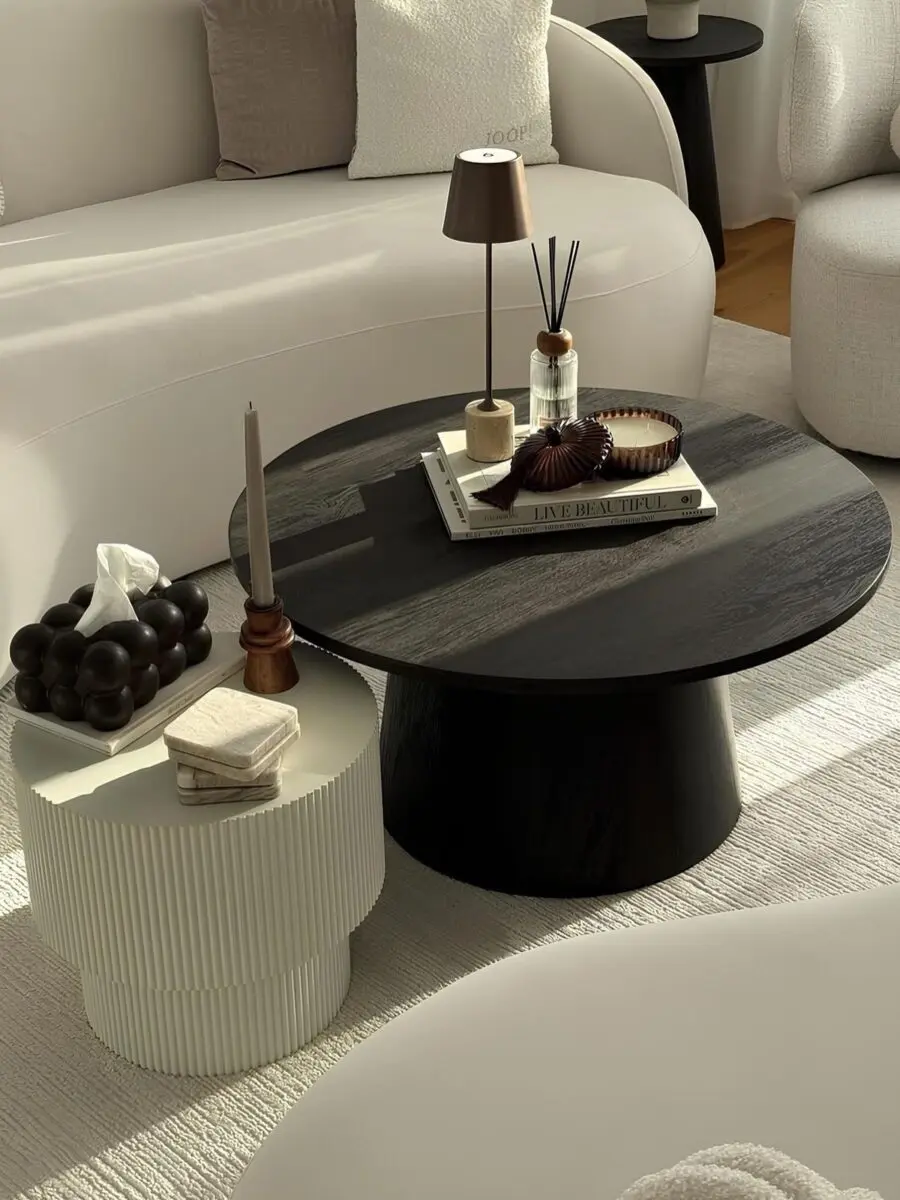 Stylish black and white coffee table arrangement