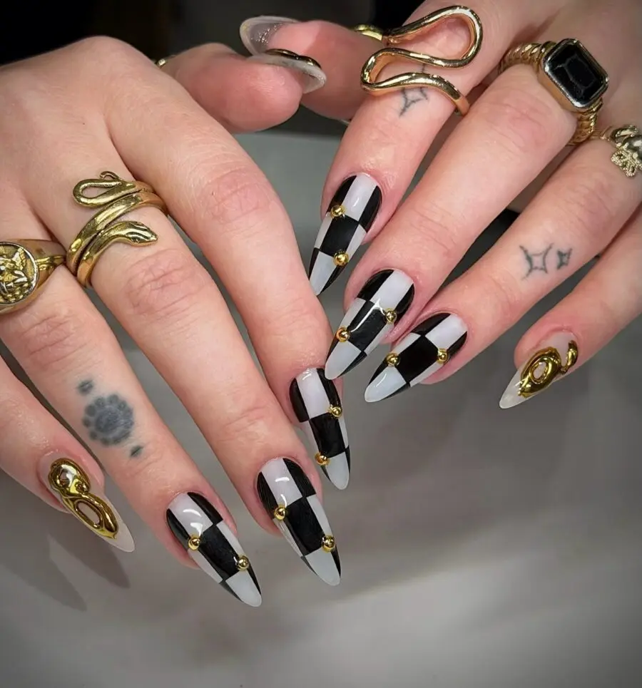 Stylish black and gold New Year's nail art