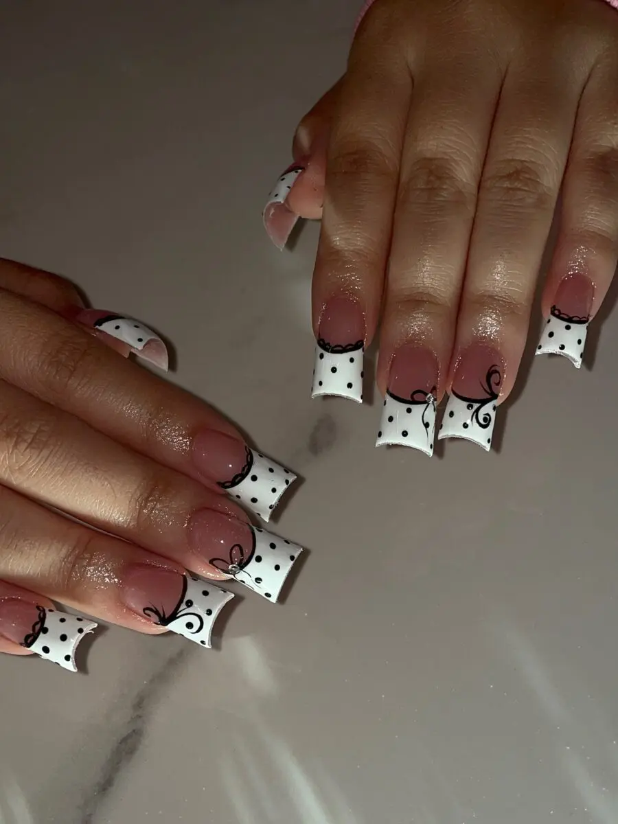 Chic duck nails with stylish polka dot design.