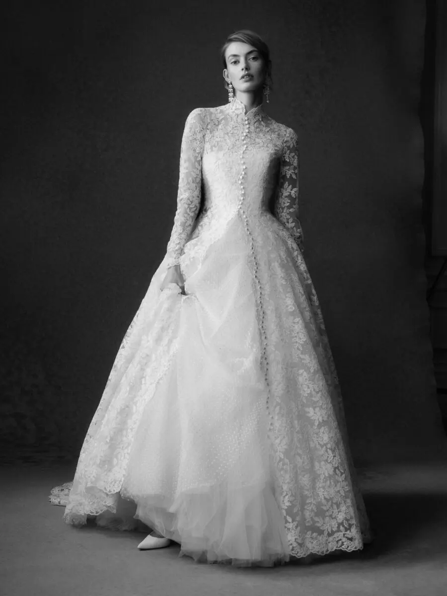 Elegant lace-sleeved wedding ballgown takes center stage.