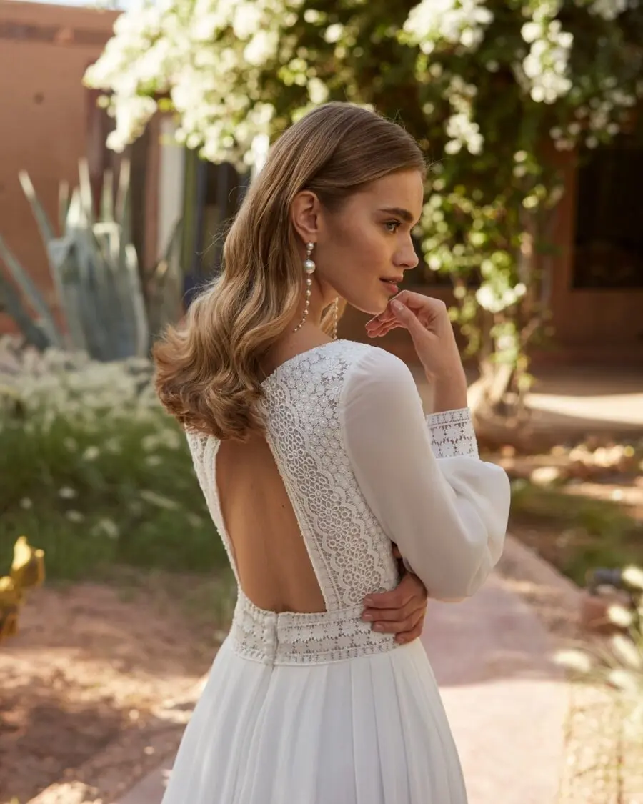 Elegant wedding dress with delicate sleeves showcased.