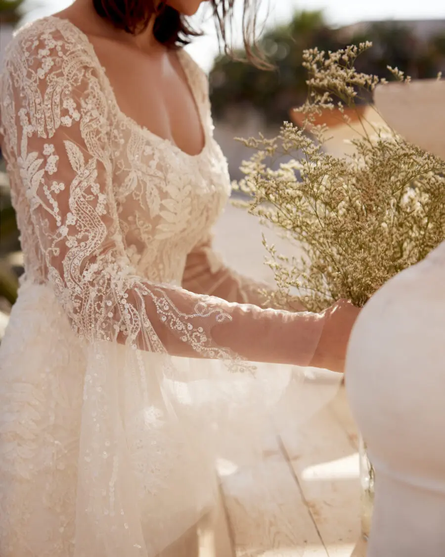 Delicate lace wedding dress with graceful sleeves