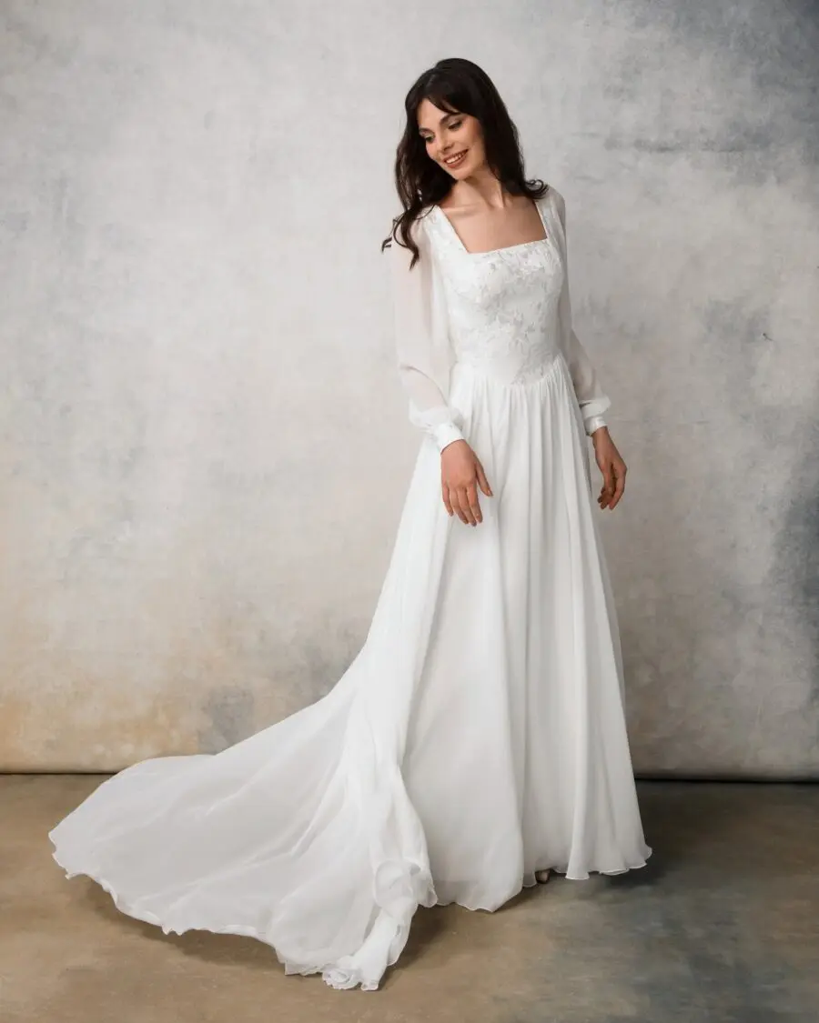 Elegant white wedding dress with long sleeves