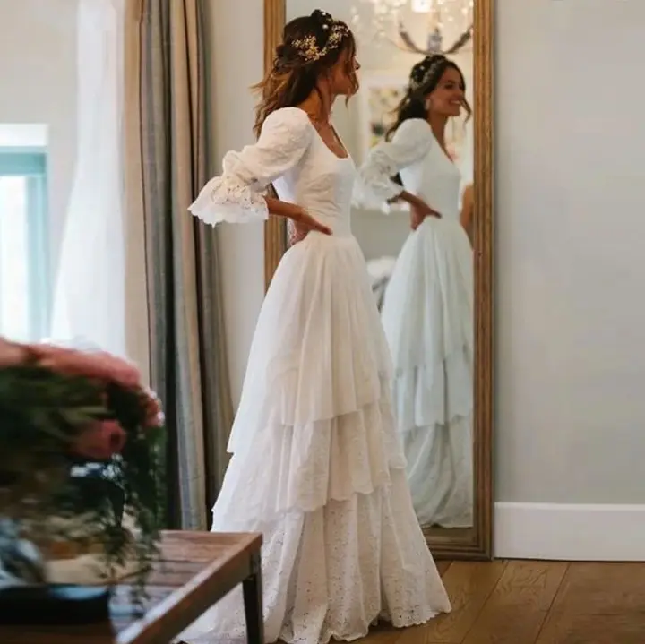 Chic long-sleeve wedding dress with layered skirt