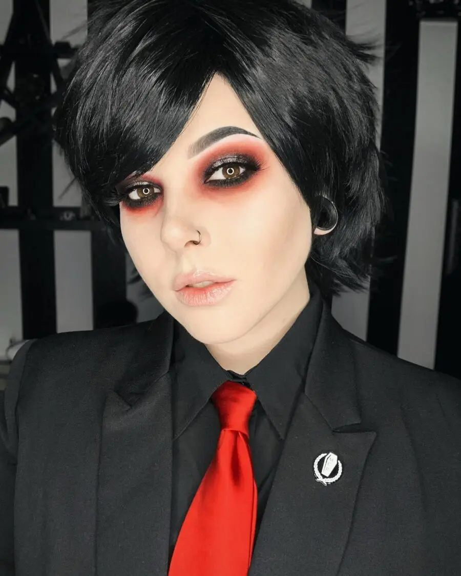 Bold black and red emo-inspired makeup look