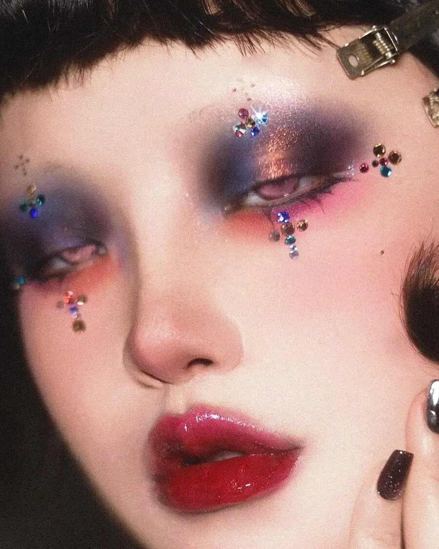 Glamorous emo makeup with sparkling gemstones