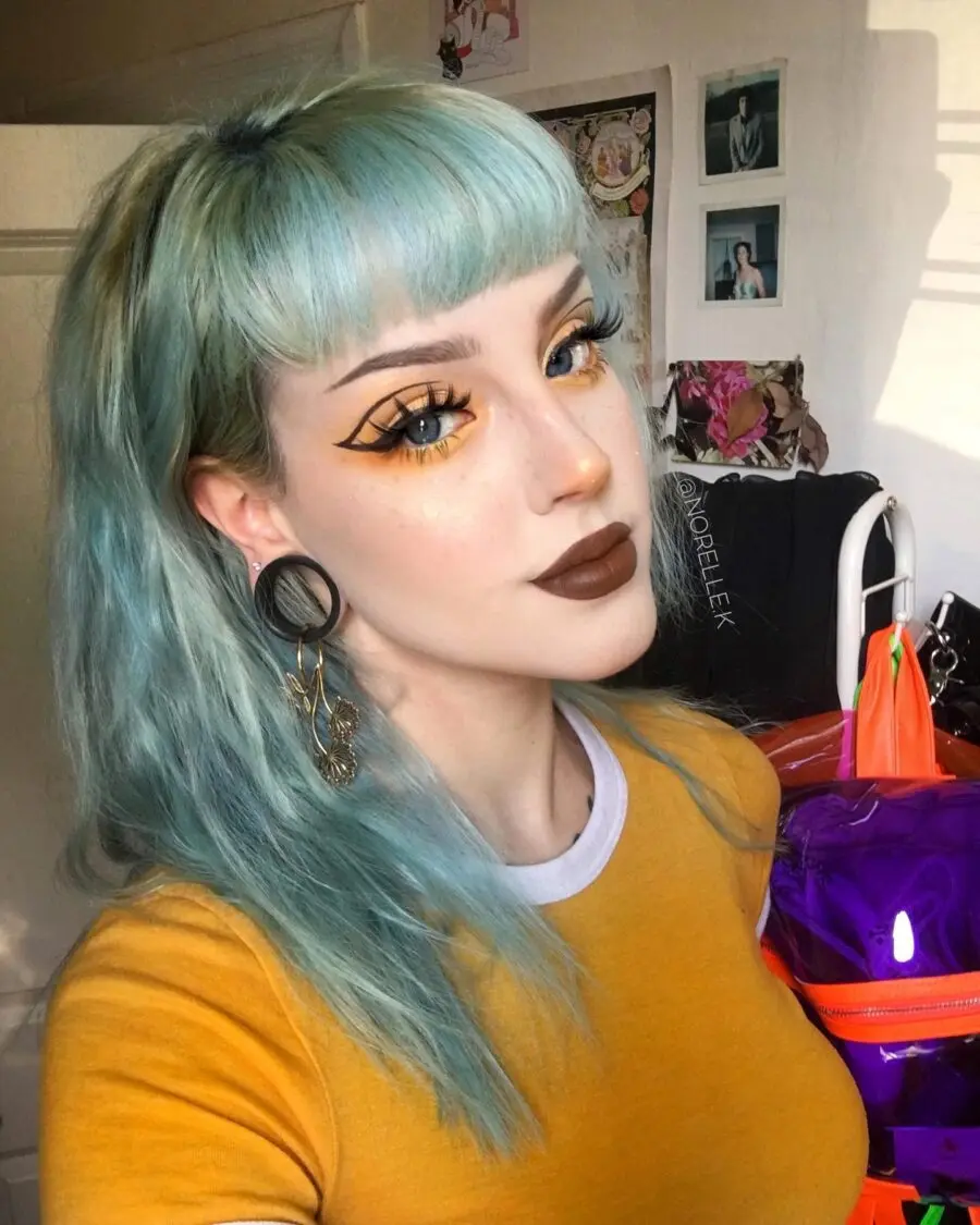 Bold yellow and black emo makeup look