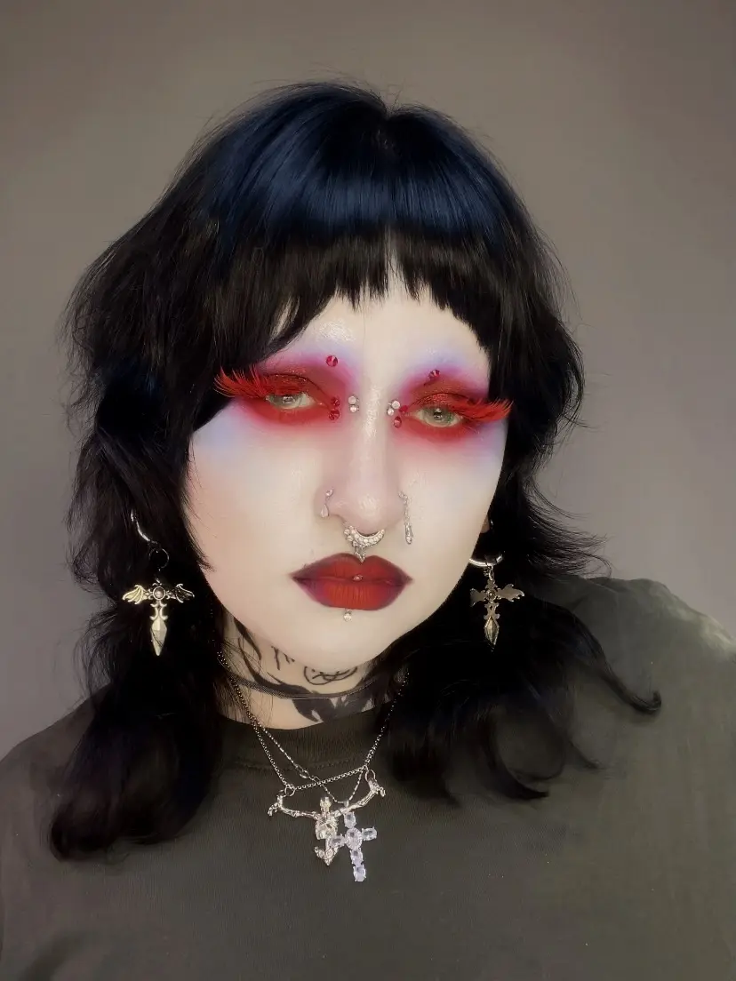 Bold red and white emo glam makeup look