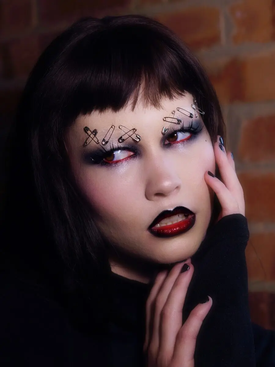 Striking emo makeup with edgy accessories