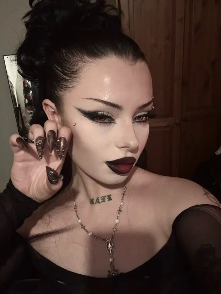 Striking emo makeup with bold contrasts
