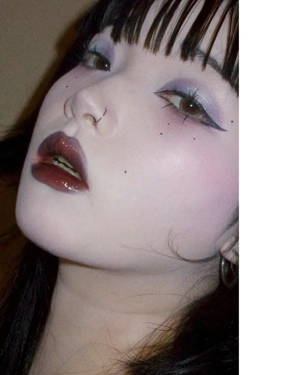 Edgy pastel emo makeup with bold lips