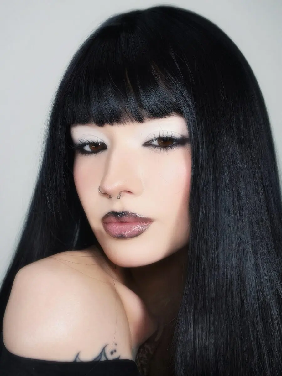 Striking emo makeup with bold features