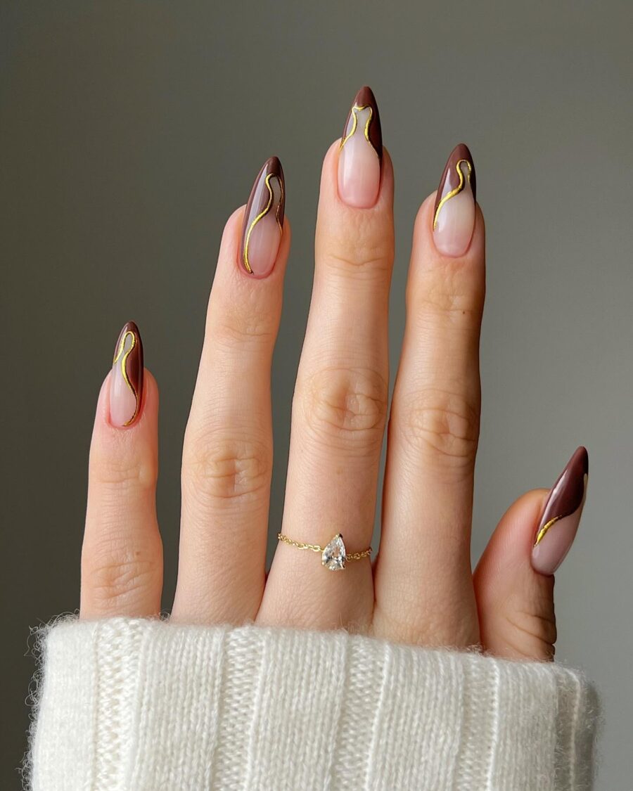 Chic Stiletto Nails with Golden Accents