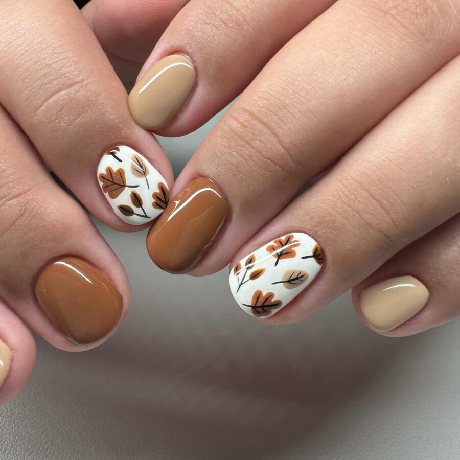 Chic fall nails with elegant leaf motifs