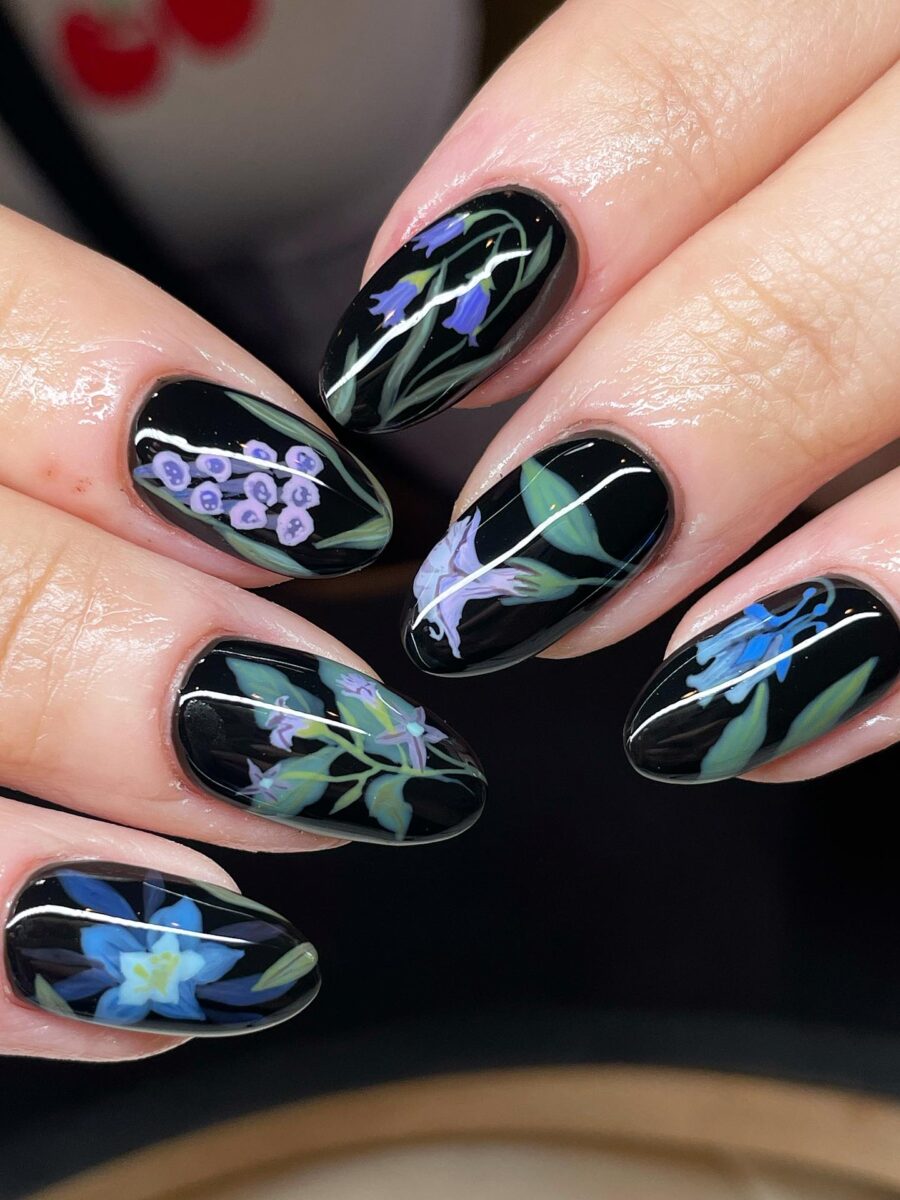Elegant Floral Designs on Glamorous Black Nails