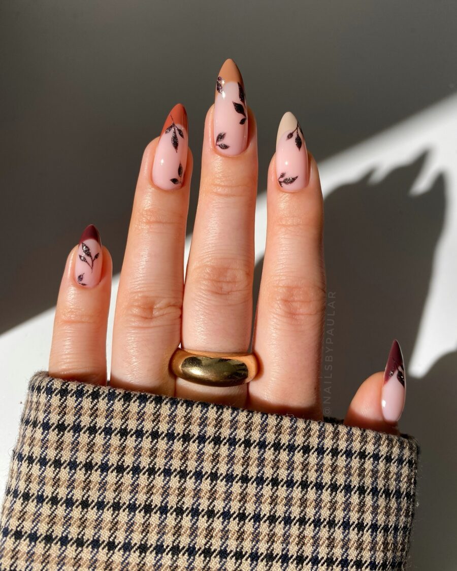 Chic fall nails featuring elegant leaf accents
