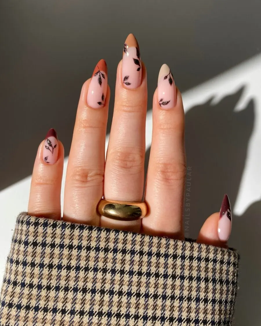Chic fall nails featuring elegant leaf accents