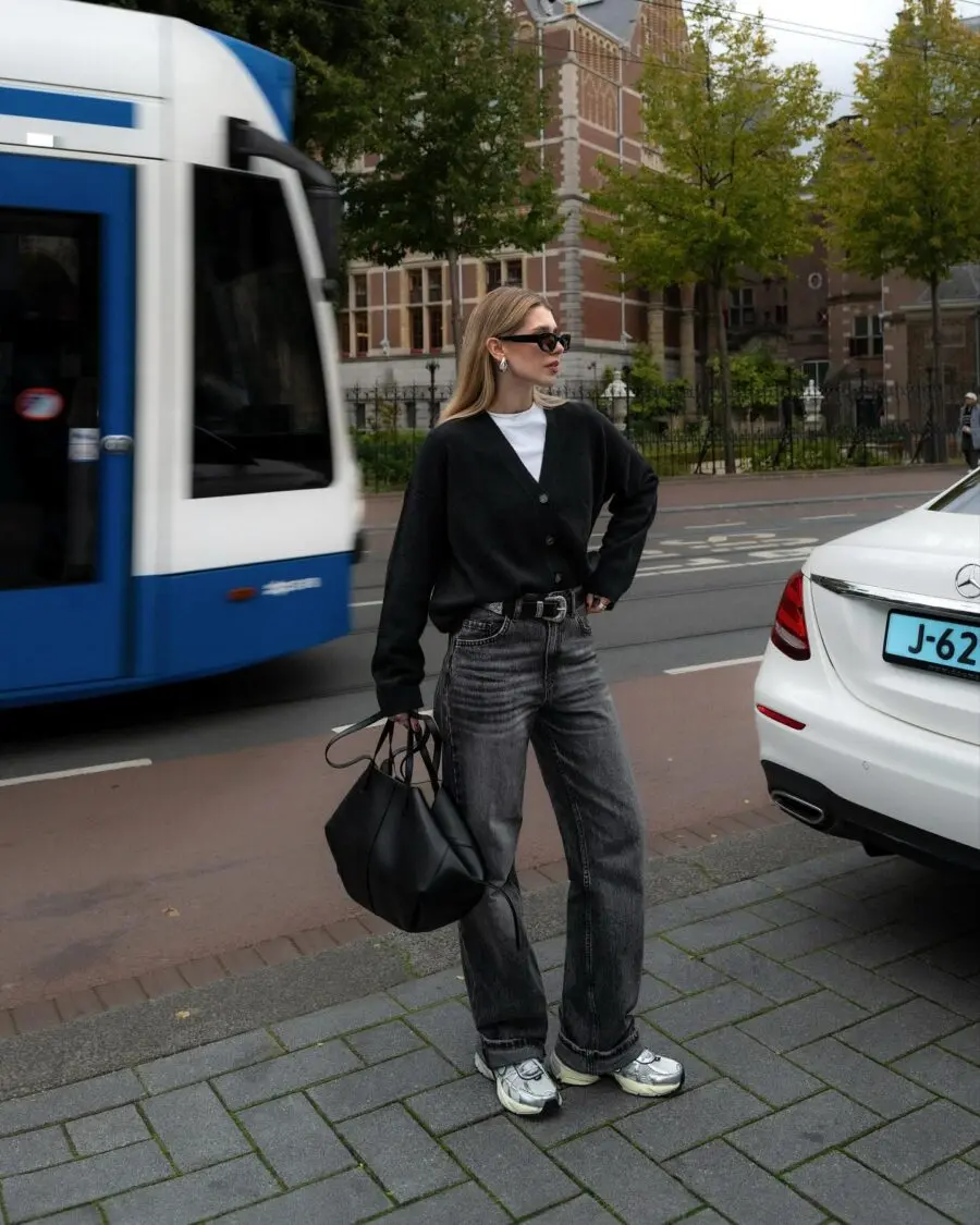 Chic black sweater paired with wide-leg jeans