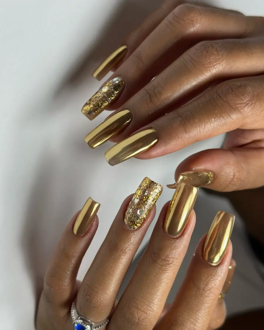 Shimmering gold nails with dazzling accents