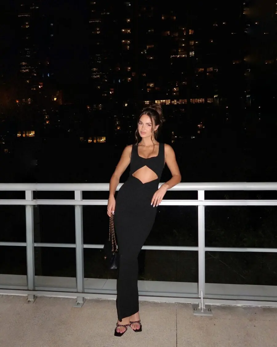 Sleek black cutout dress for nightlife styling