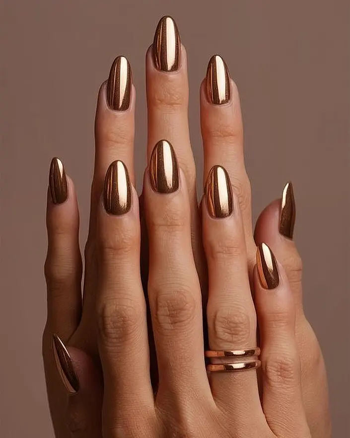 Elegant gold metallic almond-shaped nails
