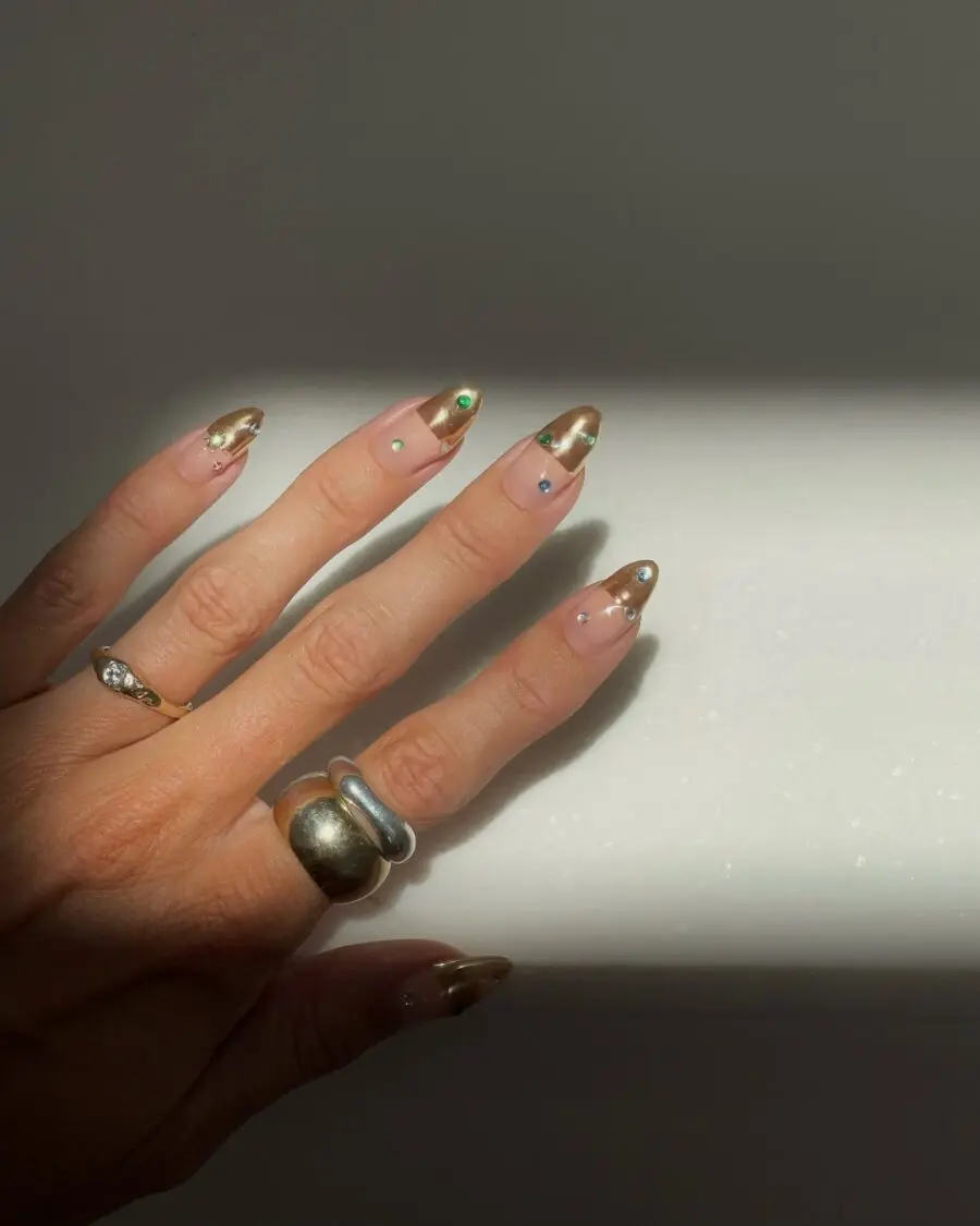 Elegant gold nails with gemstone accents