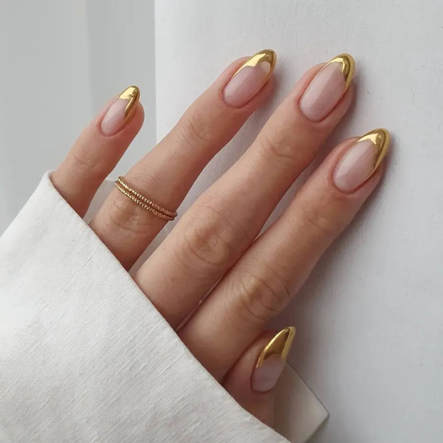 Chic gold-tipped stiletto nails for elegance