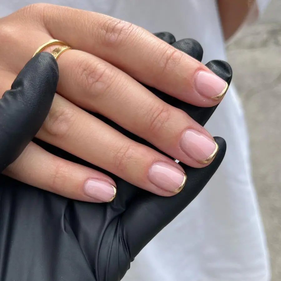Chic gold-tipped French manicure for elegant vibes