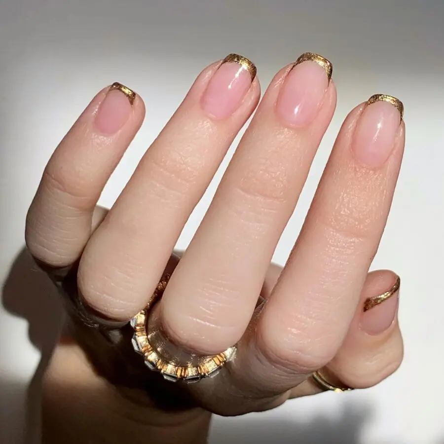 Chic gold-tipped French manicure design