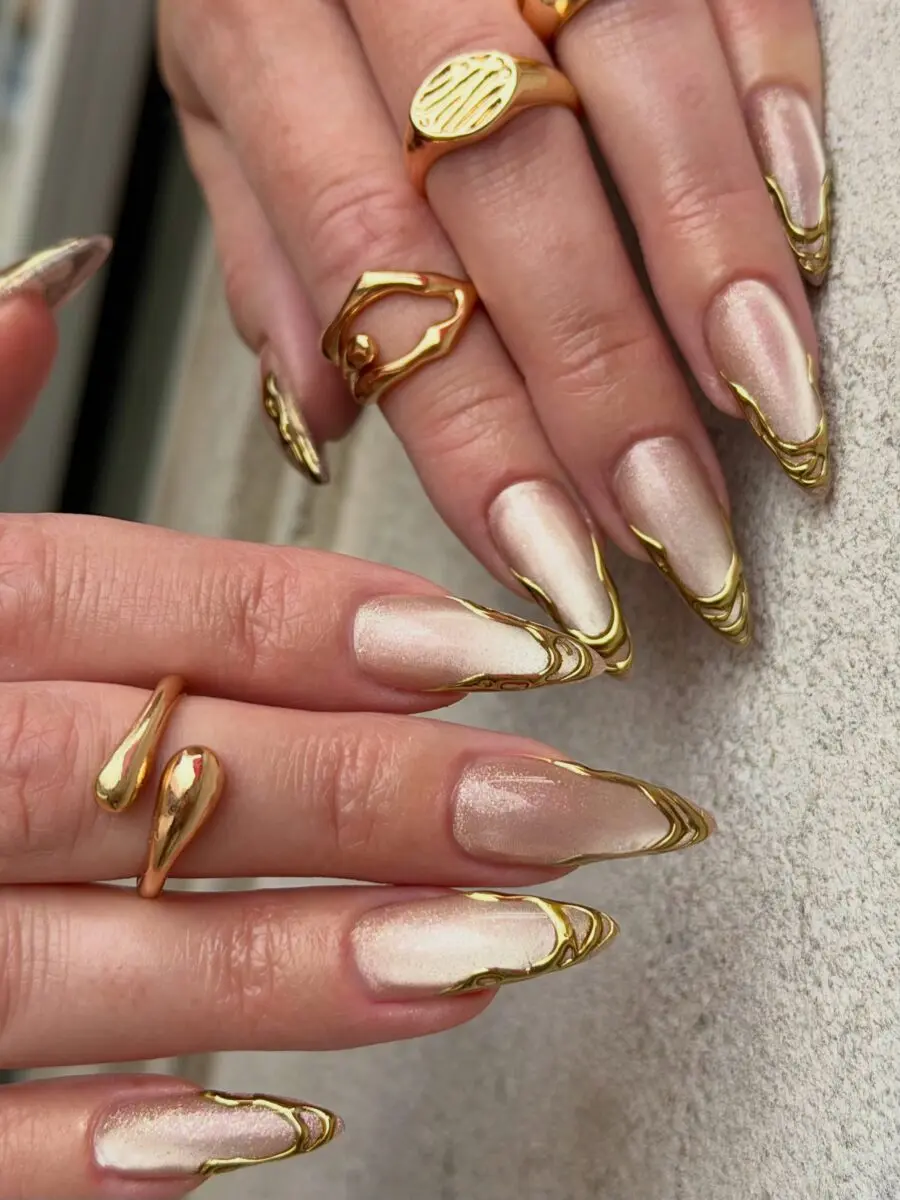 Stylish gold-accented stiletto nail design