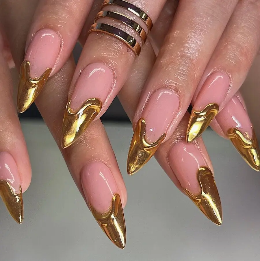 Elegant gold-accented stiletto nail design