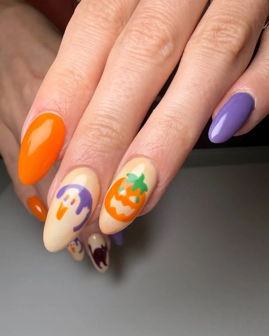 Vibrant Halloween-themed nail art with fun designs