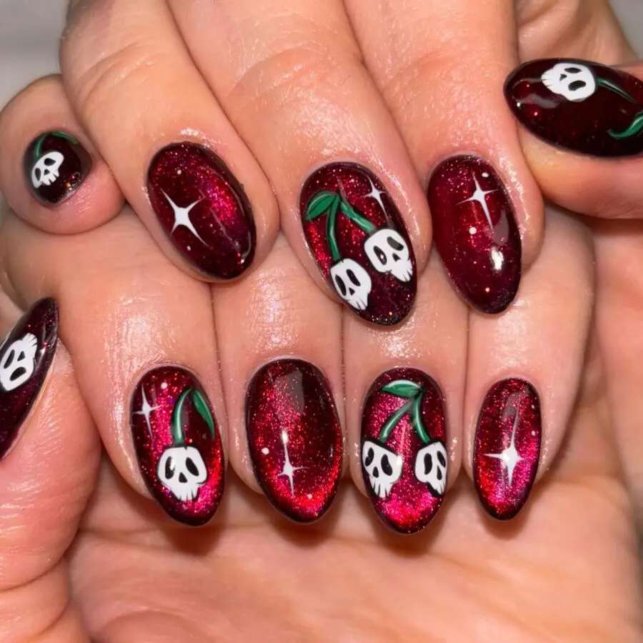Spooky red and glittery skull-themed nails