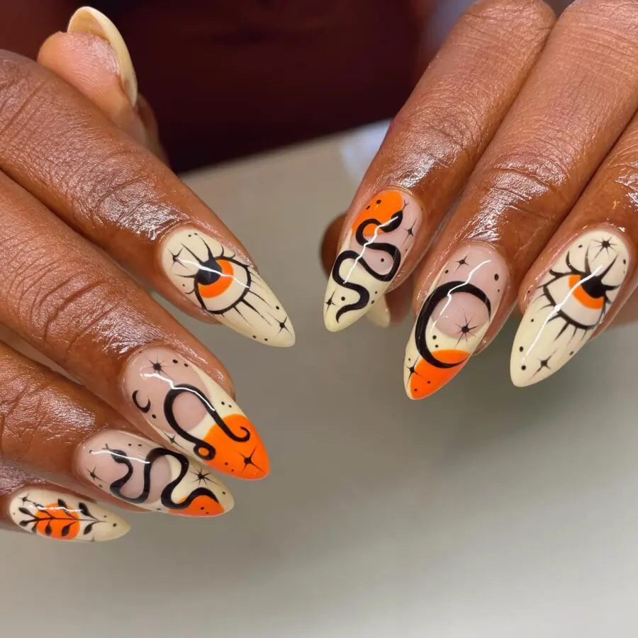 Spooky Halloween Nails With Moon and Snake Designs