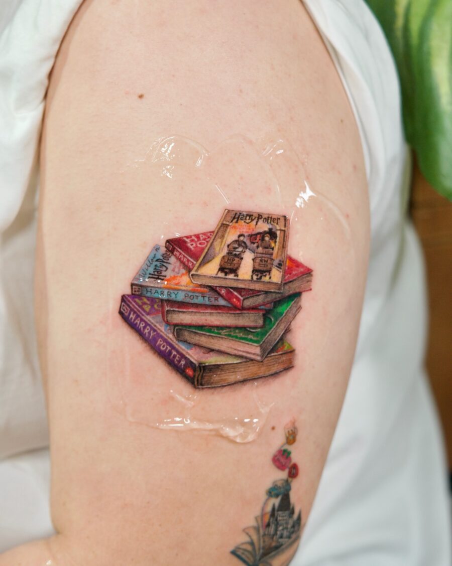 Colorful stack of Harry Potter books tattoo