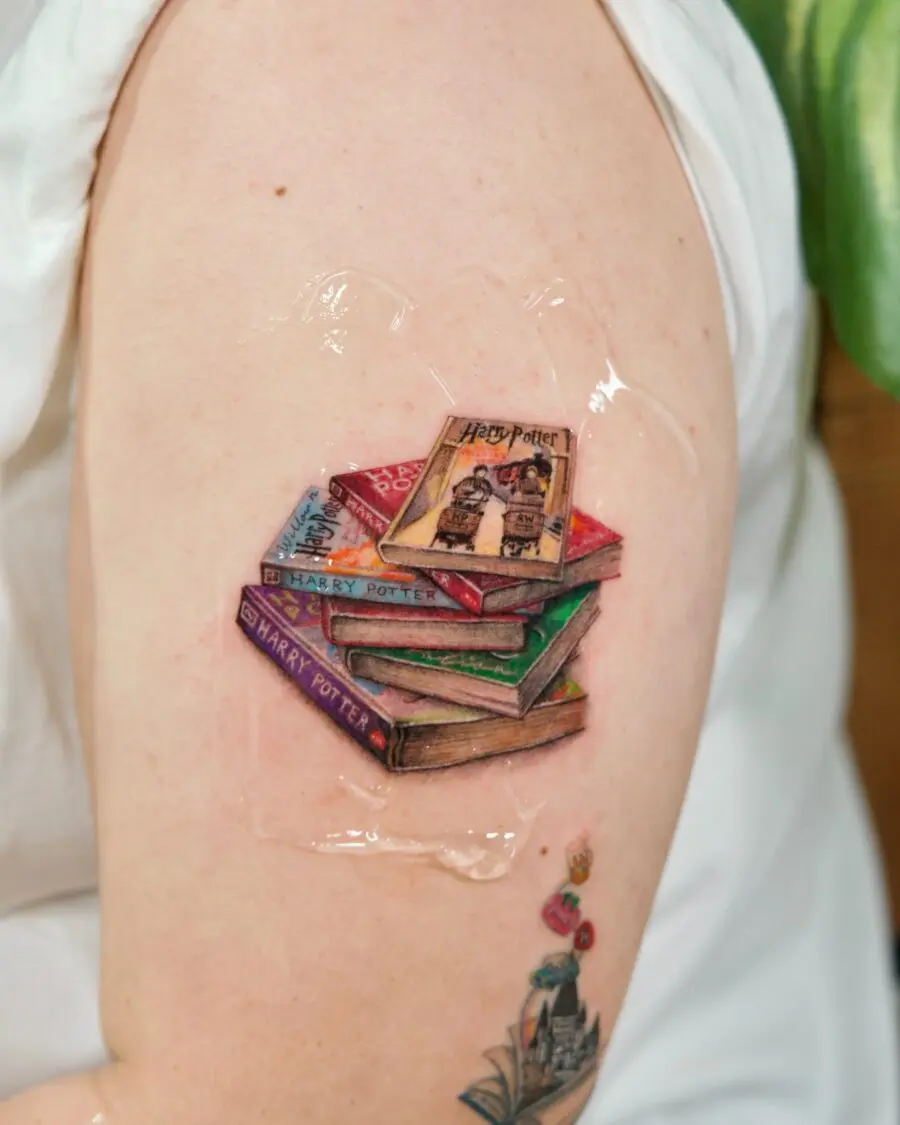 Colorful stack of Harry Potter books tattoo