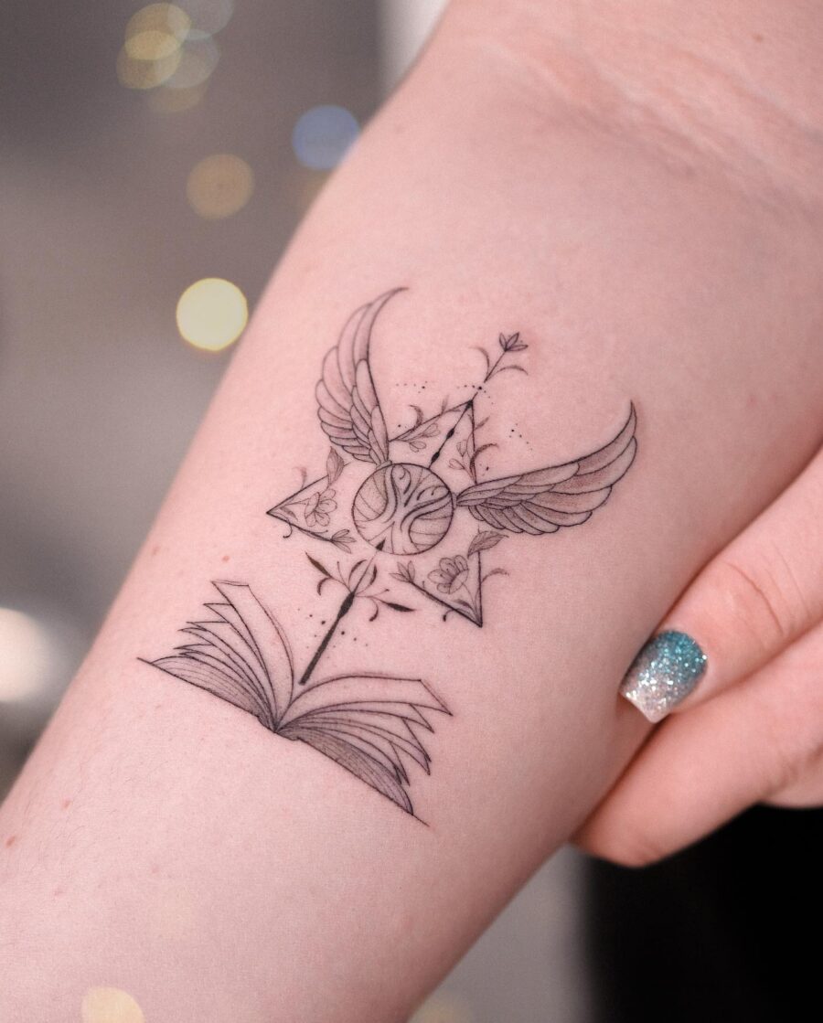 Elegant tattoo combining magic and literature themes