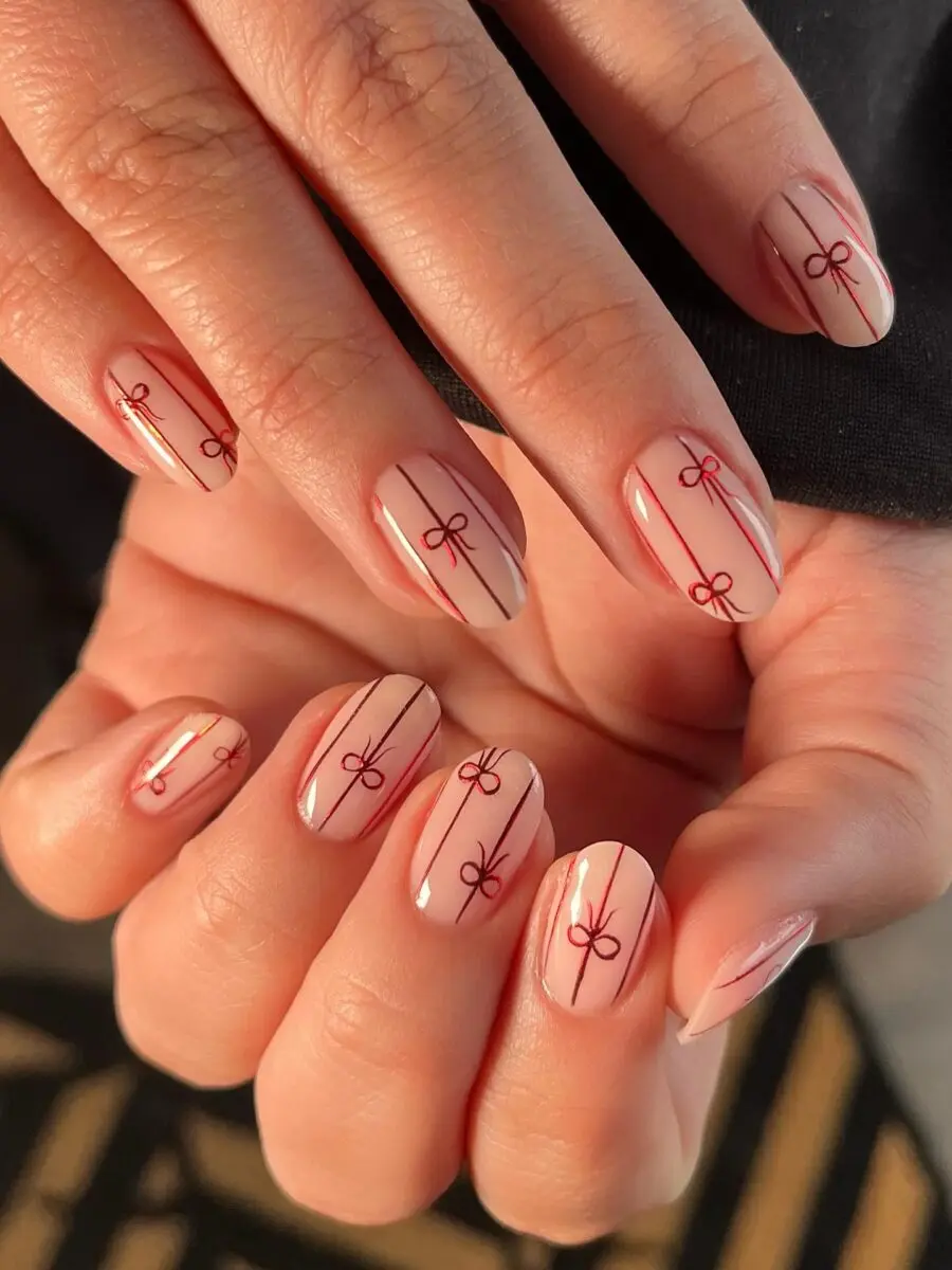 Elegant red bow themed Christmas nails