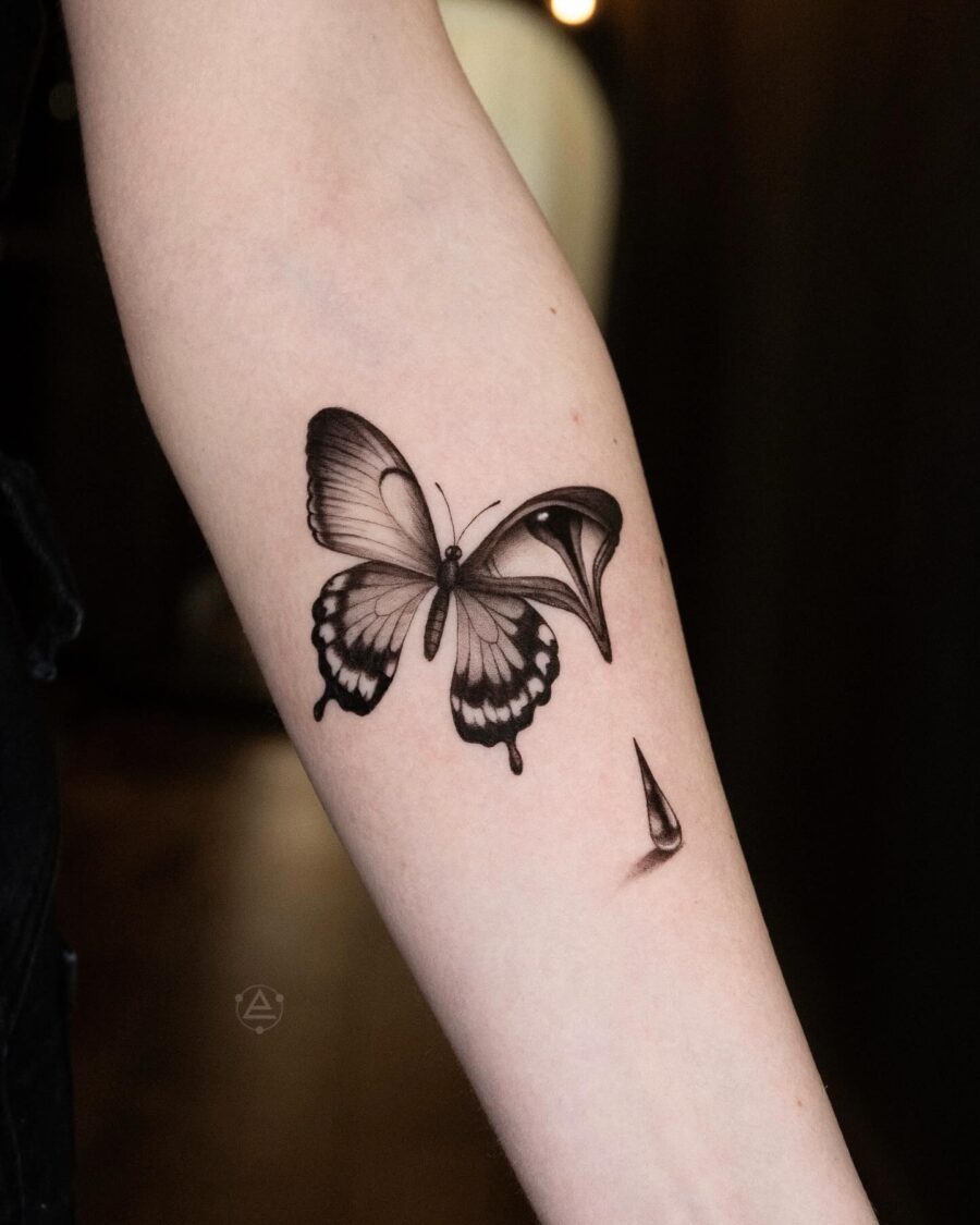 Elegant butterfly tattoo with teardrop details