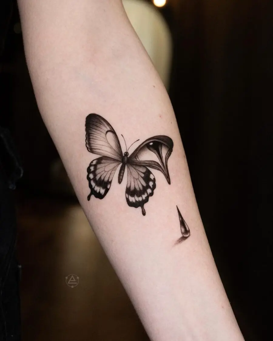 Elegant butterfly tattoo with teardrop details