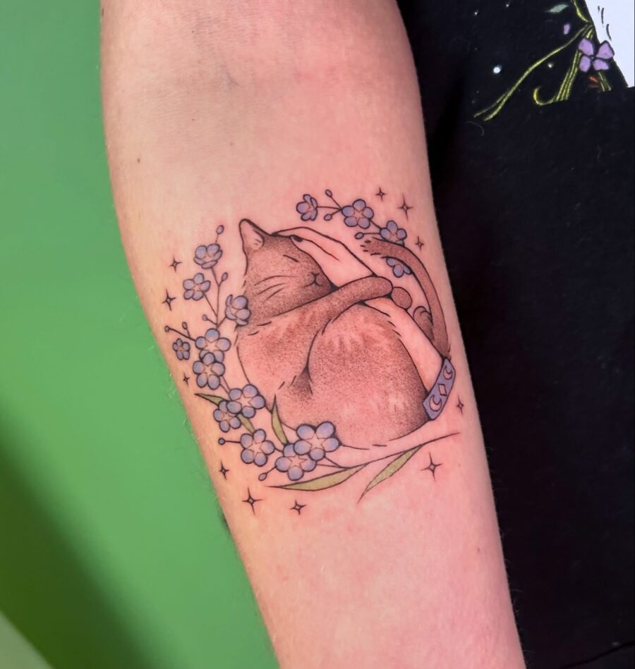 Endearing cat memorial tattoo with floral elements