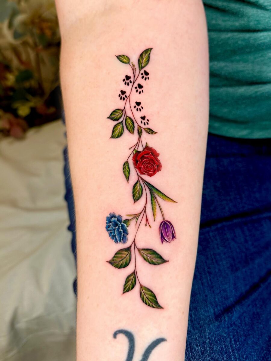 Vibrant floral sleeve tattoo for remembrance