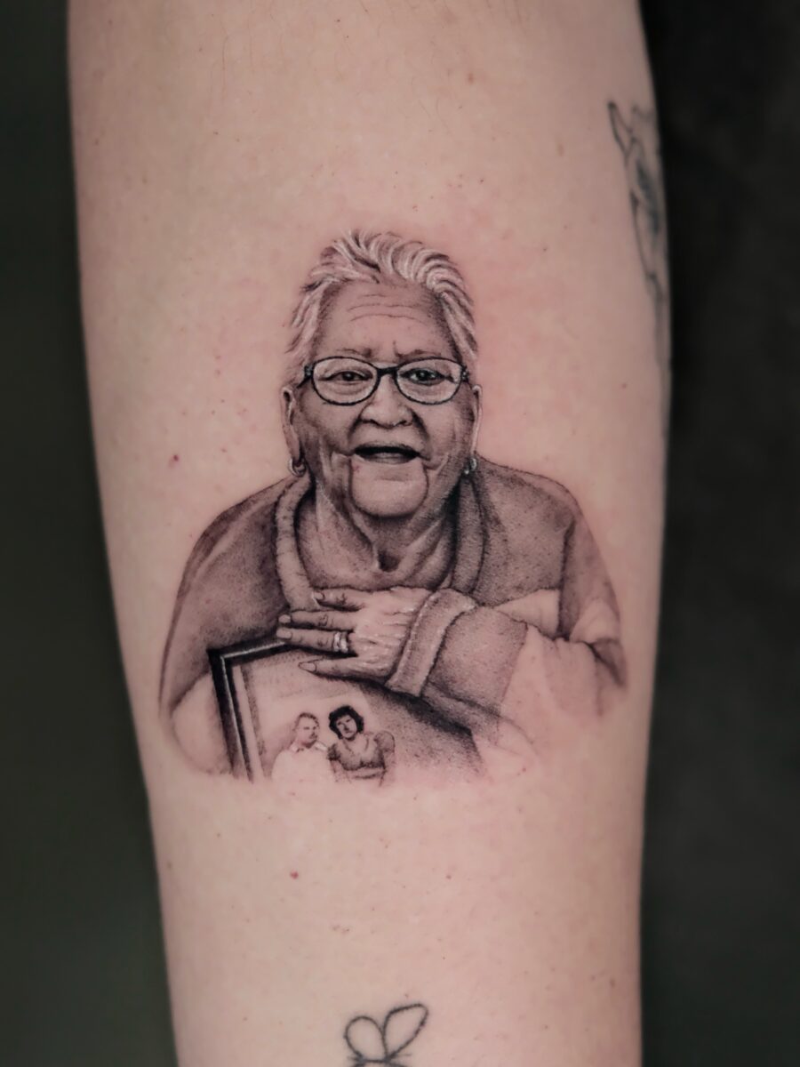 Cherishing grandmother with a heartfelt portrait tattoo