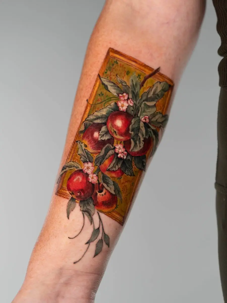 Vibrant memorial tattoo featuring fruit and flowers