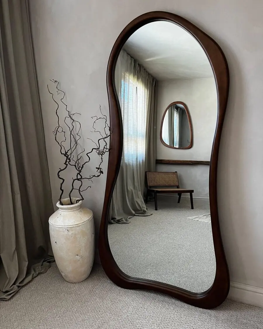 Elegant curved mirror adds sophisticated charm