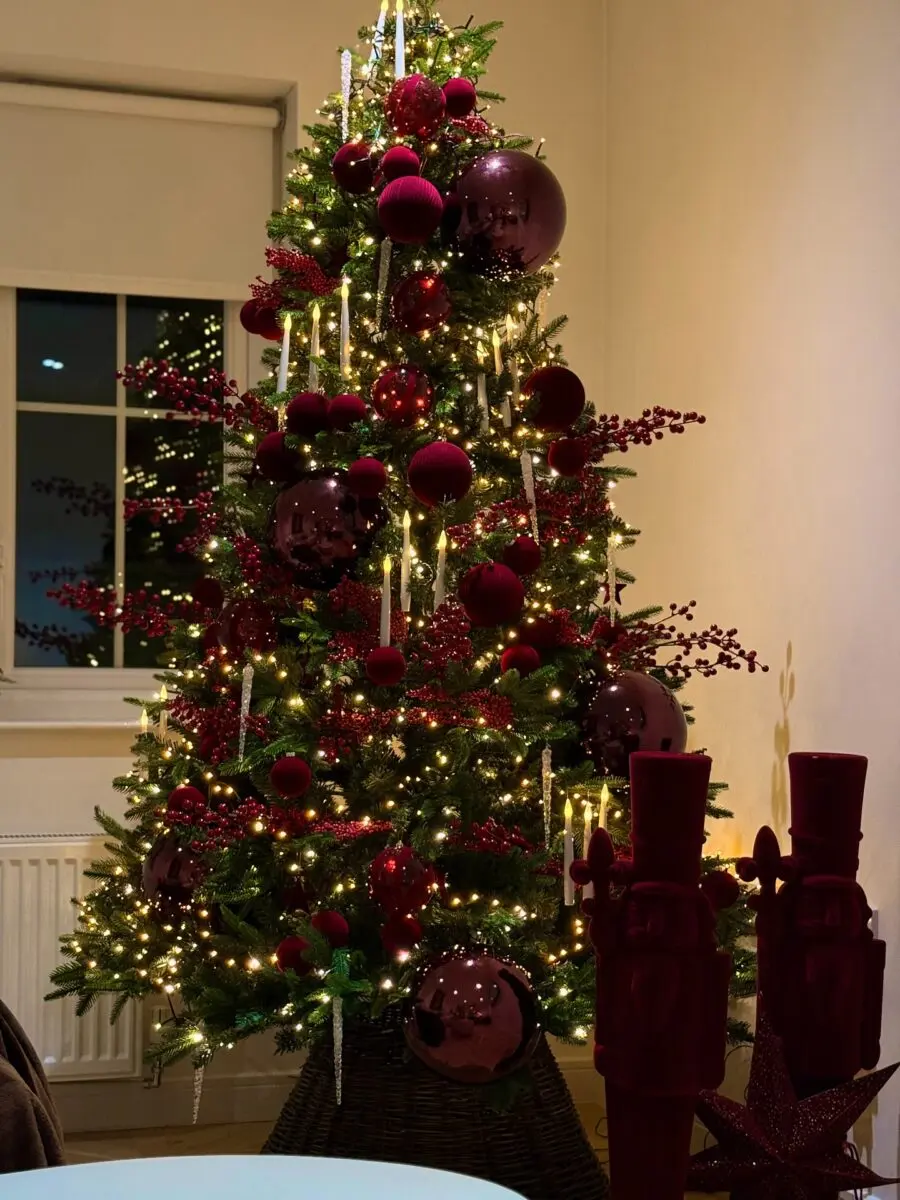 Elegant Christmas tree with red accents and lights